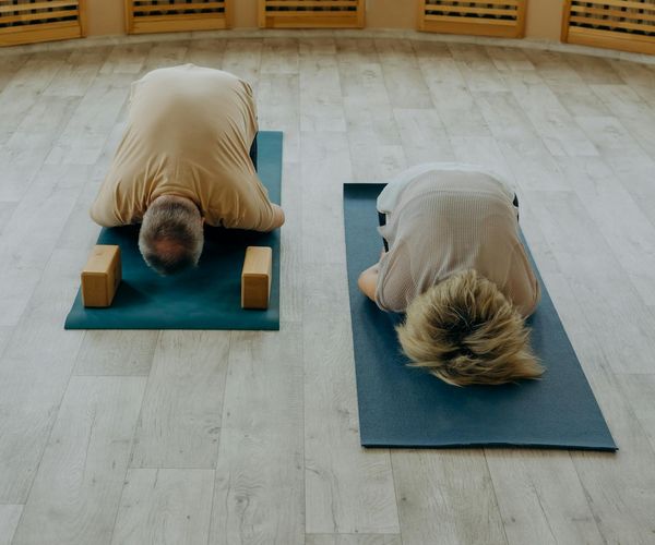Diverse group of people of different ages practicing yoga together.